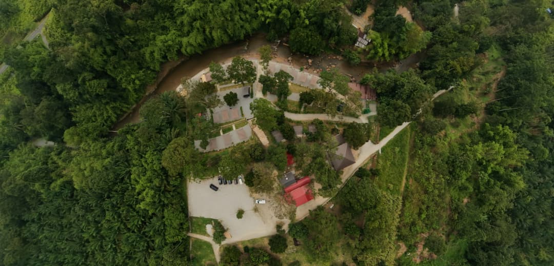 Bird's-eye view of the campground, parking area and river
