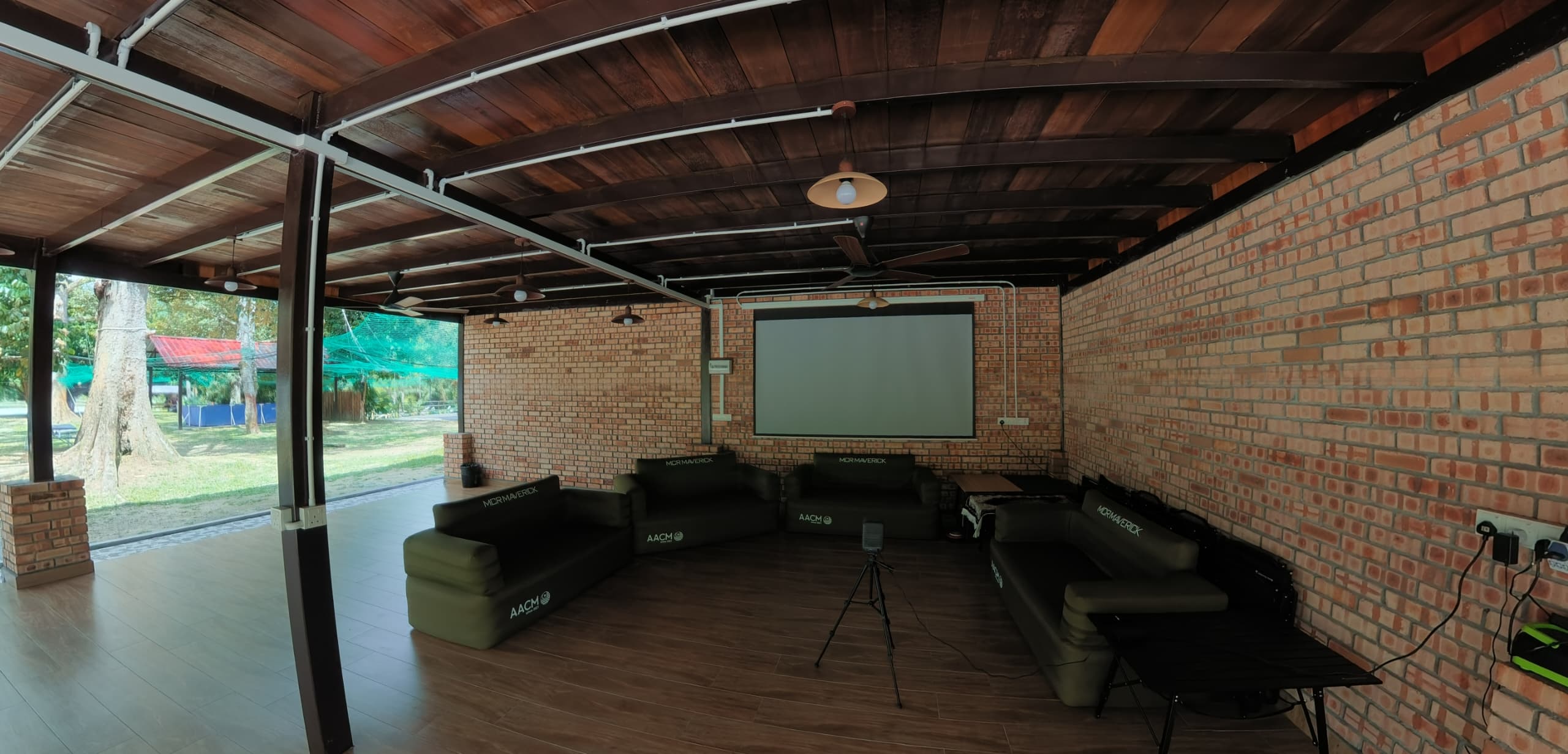 Hall with wooden ceiling, fans and projector screen