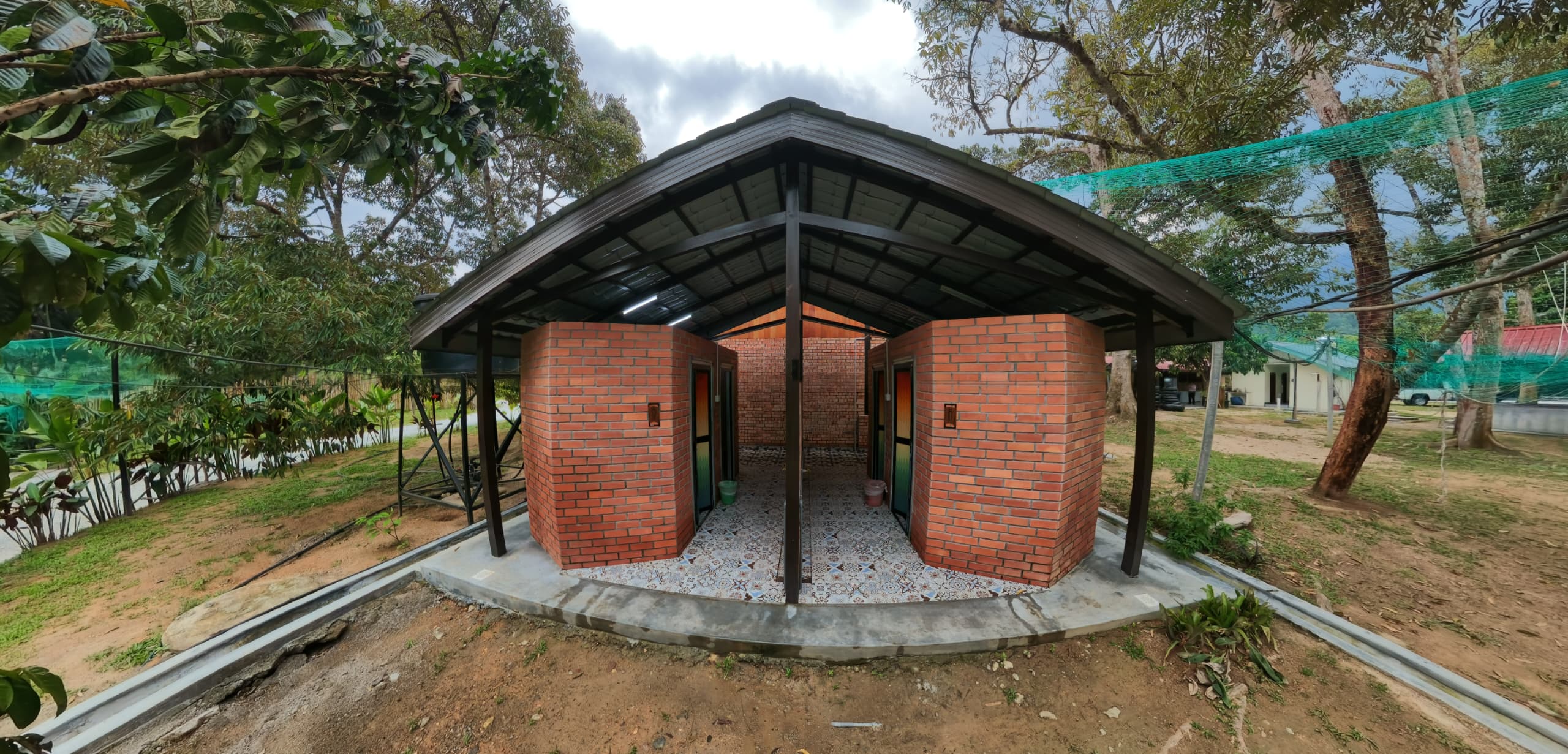 Brick toilet block with patterned tile floor